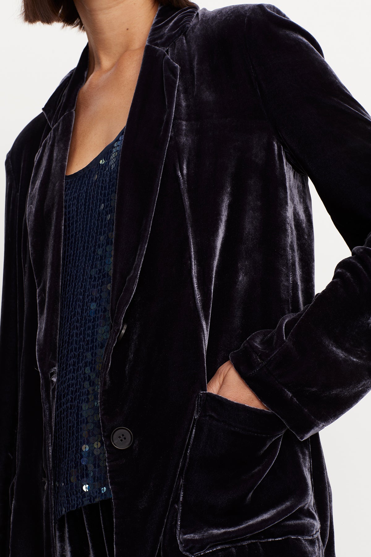 A woman wearing an oversized fit KYLA SILK VELVET BLAZER by Velvet by Graham & Spencer.-35577748029633