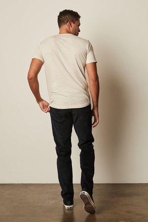 the back of a man wearing AMARO CREW NECK SLUB TEE by Velvet by Graham & Spencer jeans and a t - shirt.