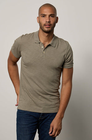 Niko Polo in cypress green with dark blue denim front