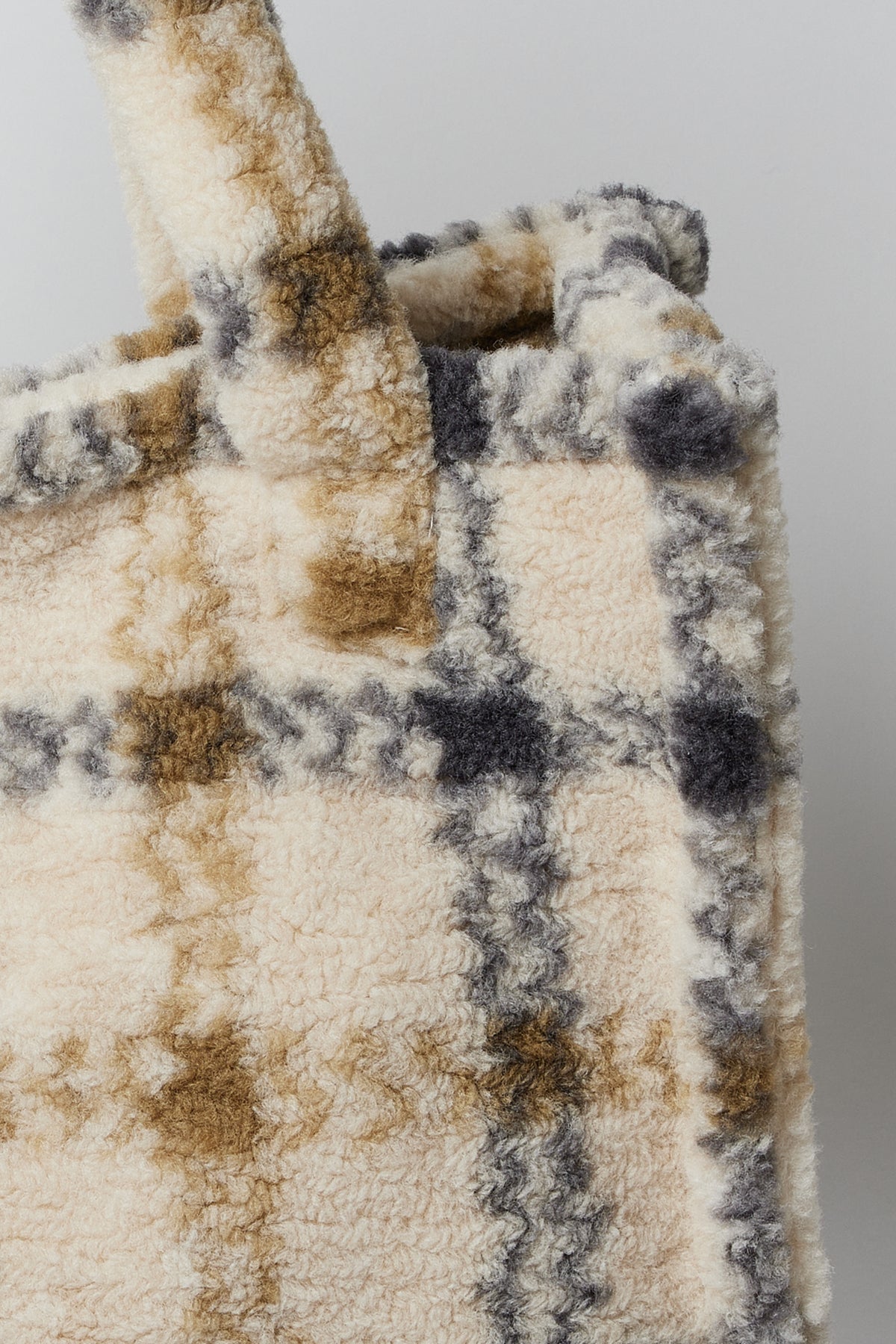 A beige and black plaid SMALL TEDDY TOTE by Velvet by Graham & Spencer on a white background.