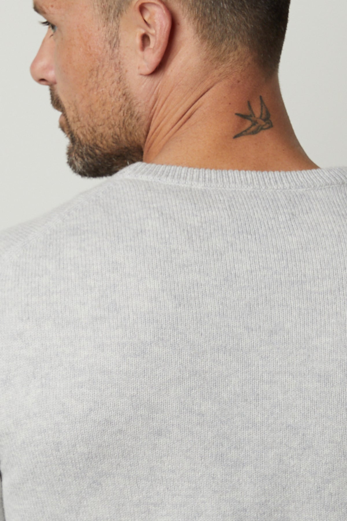 A stylish man wearing a warm Velvet by Graham & Spencer DASHELL CREW NECK SWEATER.-35782497075393