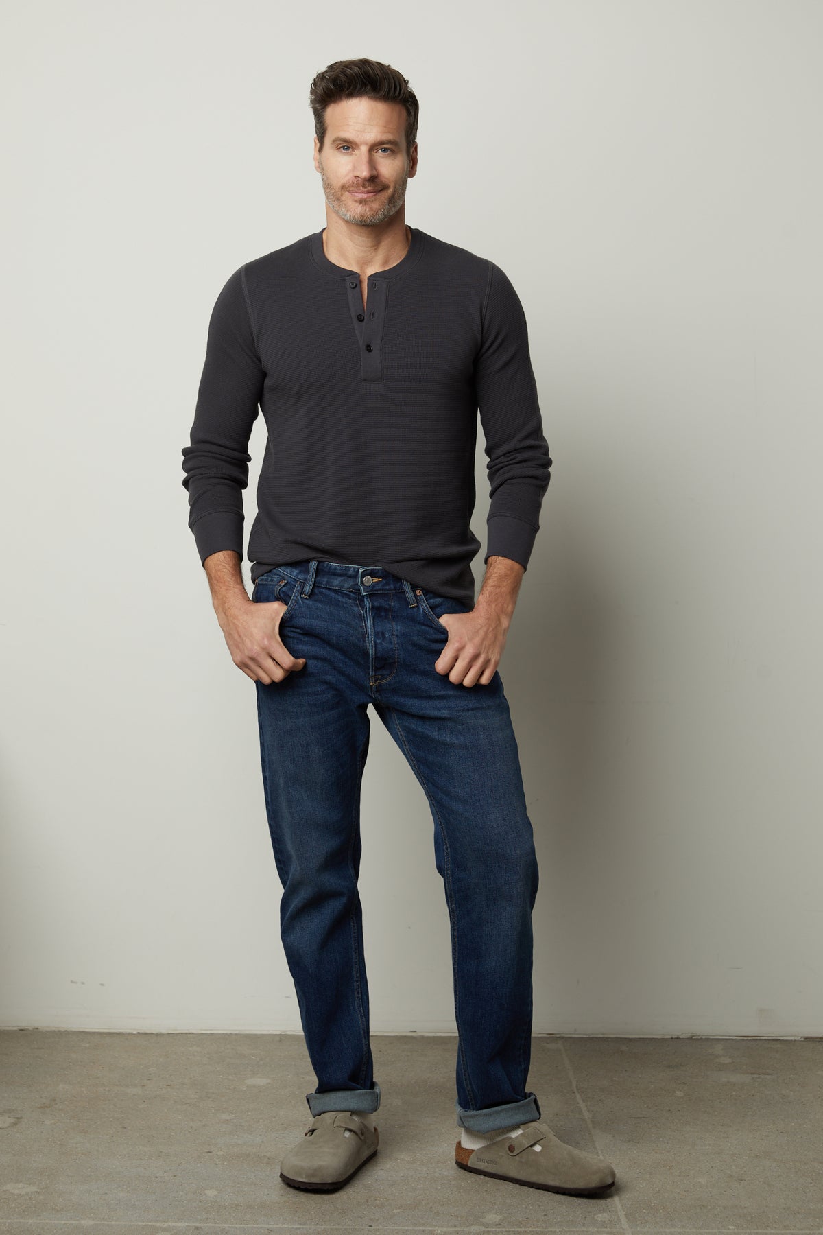 A man wearing a DEX Thermal Henley by Velvet by Graham & Spencer for layering.-35231535956161
