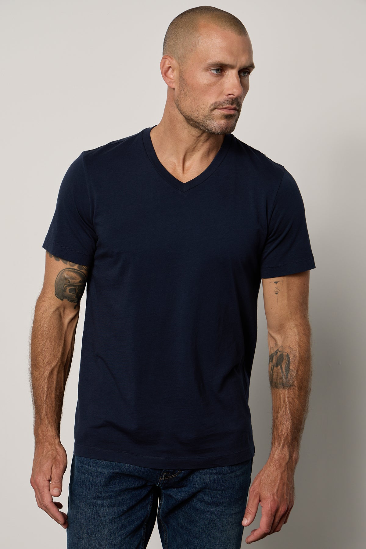 A man wearing a Velvet by Graham & Spencer MARSHALL V-NECK TEE.-26514079613121