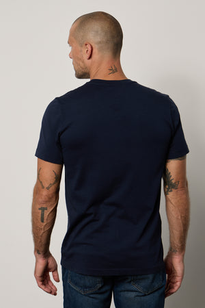 The back view of a man wearing a Velvet by Graham & Spencer MARSHALL V-NECK TEE.