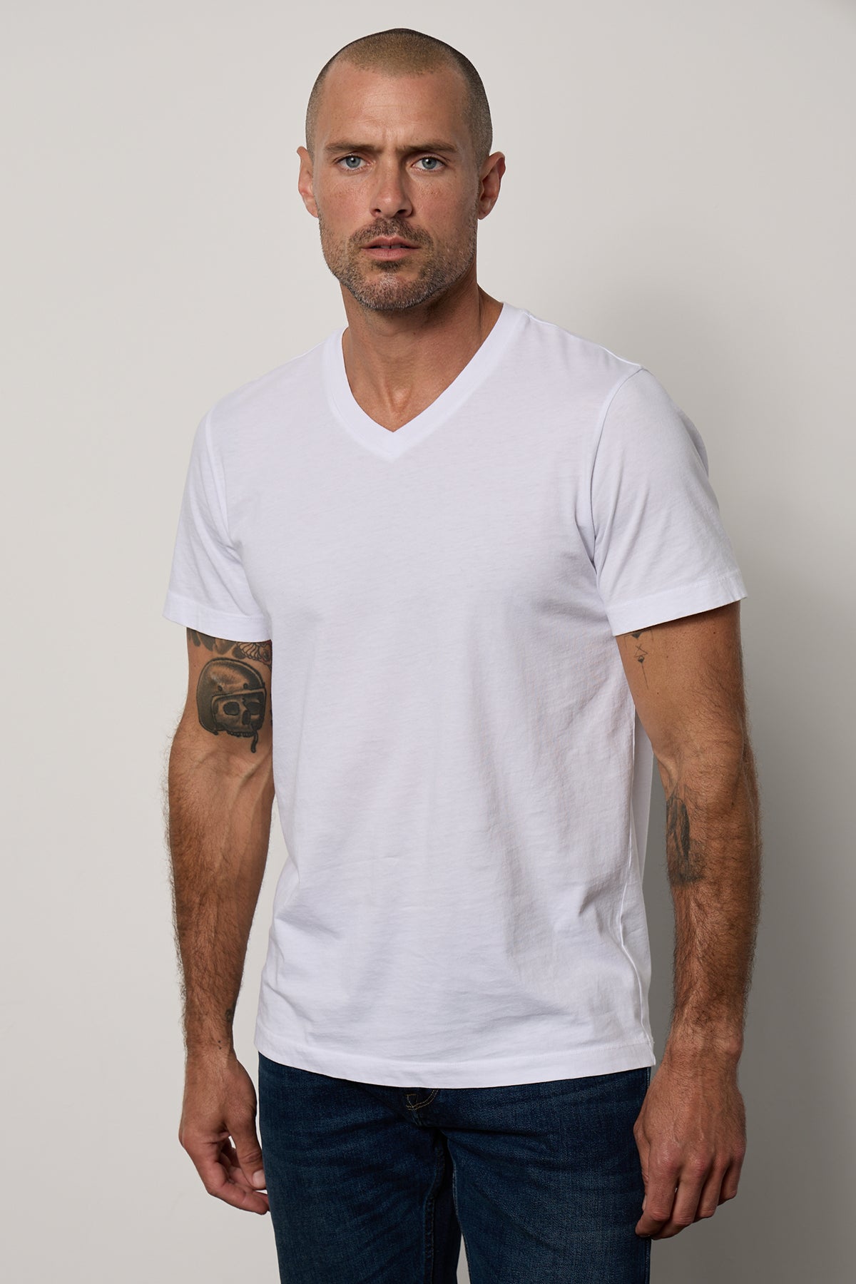 a man wearing a white Velvet by Graham & Spencer MARSHALL V-NECK TEE.-26514078171329