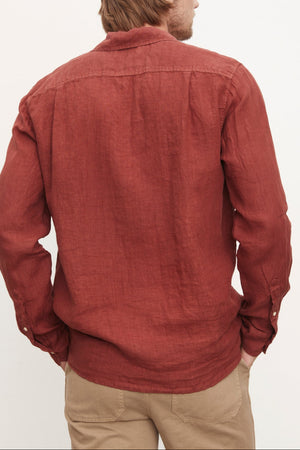The stylish back view of a man wearing a Velvet by Graham & Spencer BENTON LINEN BUTTON-UP SHIRT.
