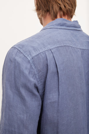 The stylish back view of a man wearing a Velvet by Graham & Spencer BENTON LINEN BUTTON-UP SHIRT.