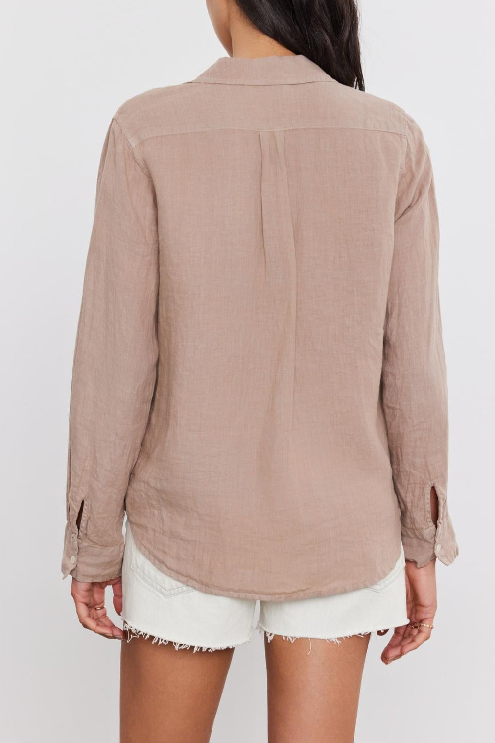 Woman from behind, wearing a NATALIA LINEN BUTTON-UP SHIRT by Velvet by Graham & Spencer and white shorts, standing against a plain background.-36752935878849
