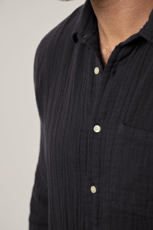 a man wearing a Velvet by Graham & Spencer ELTON BUTTON-UP SHIRT.