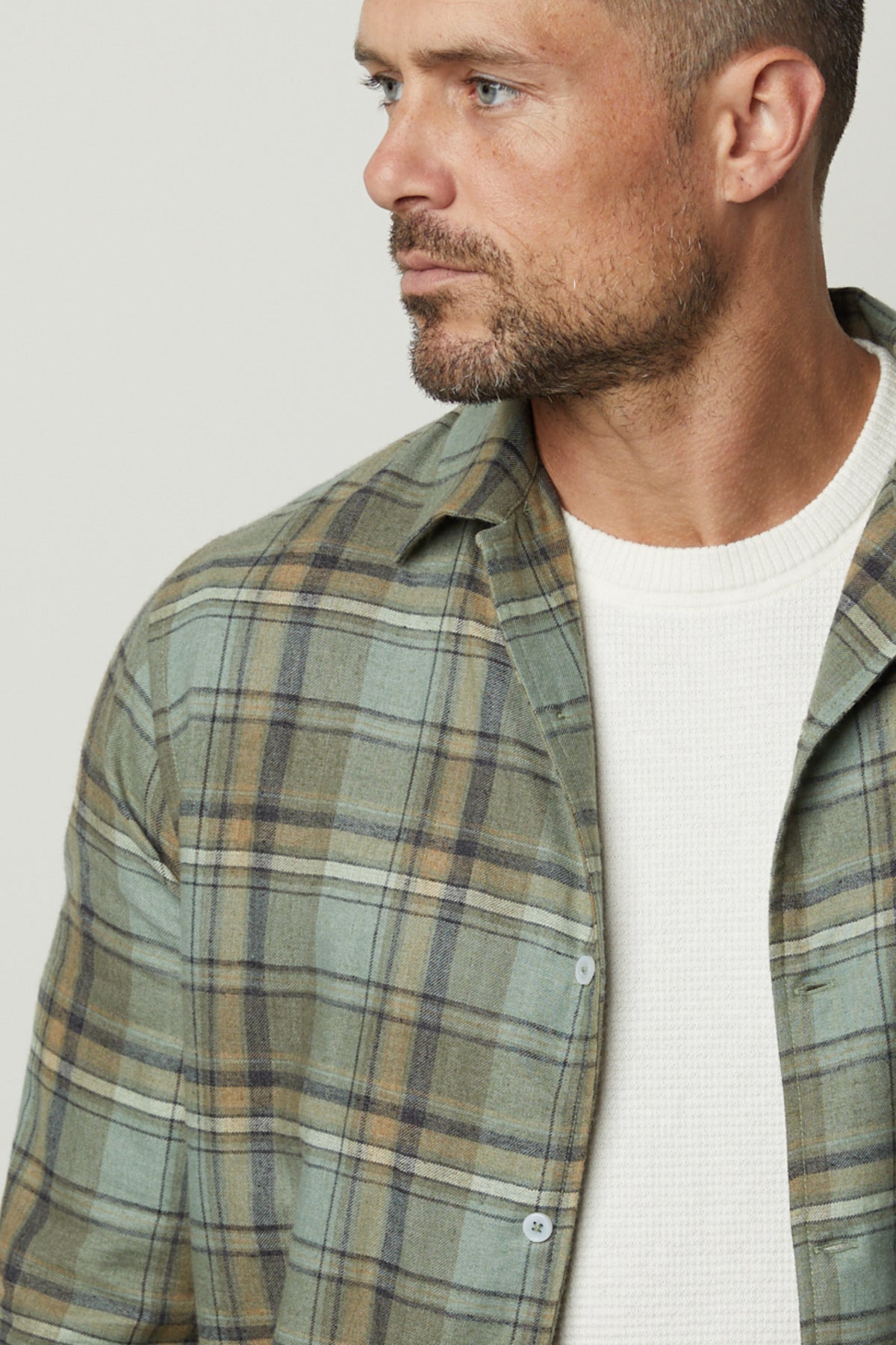 A man wearing a Velvet by Graham & Spencer TIMOTHY PLAID BUTTON-UP SHIRT.-26768086335681
