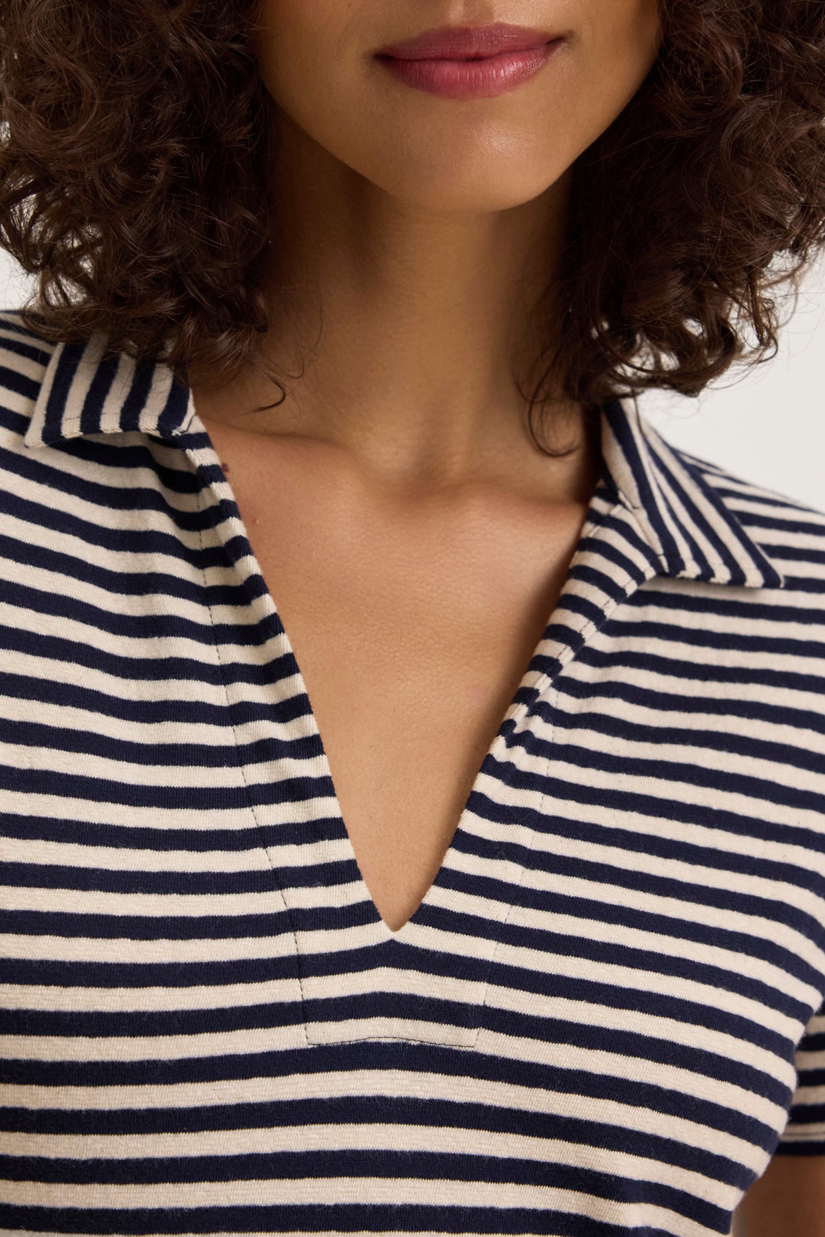 Someone wearing the KHAN DRESS from Velvet by Graham & Spencer, featuring navy and white stripes with a collar, crafted from soft cotton jersey.-38820667490497