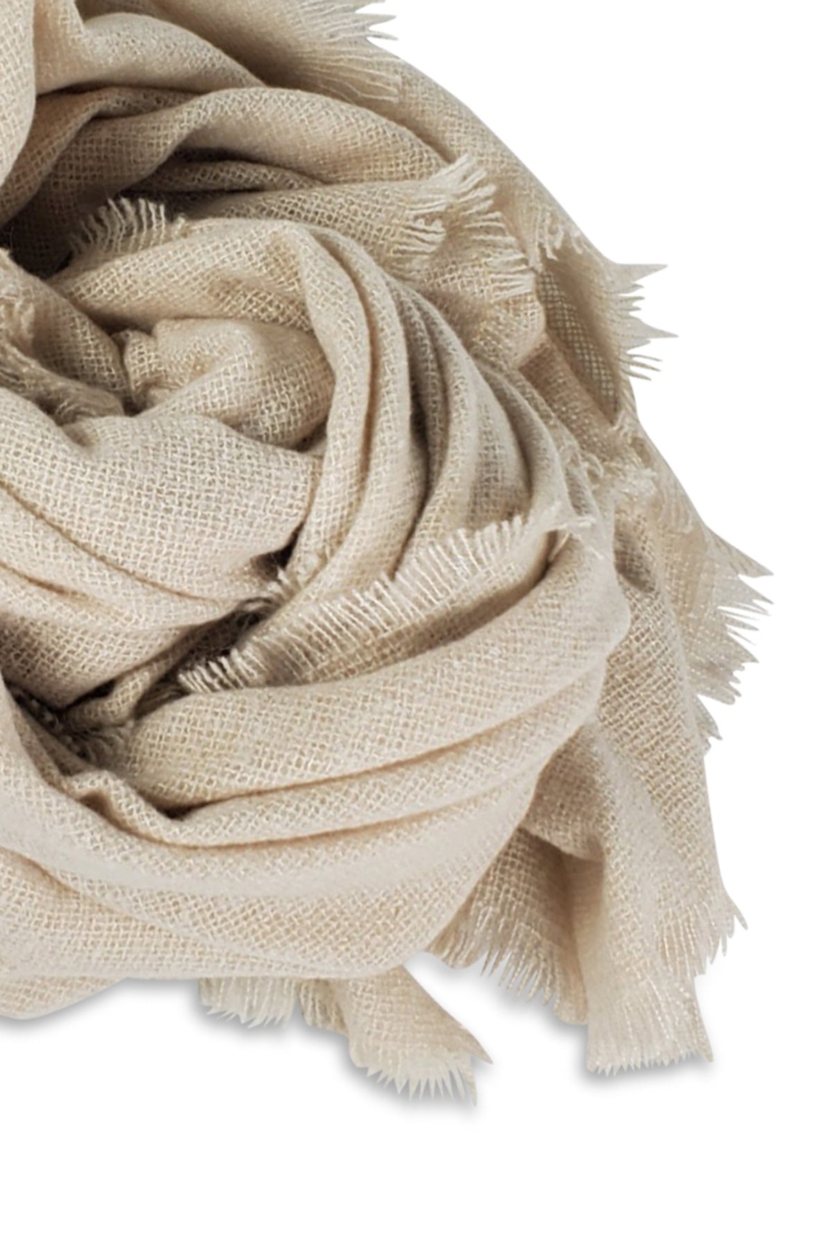 Close-up of the COZY SOLID SCARF by Velvet by Graham & Spencer, a loosely folded beige jumbo scarf with frayed edges, perfect for winter style, displayed on a white background.-23396477436097