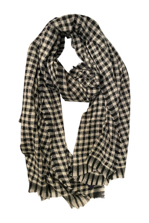 The SMALL CHECK SCARF by Velvet by Graham & Spencer features a black and white checkered design with fringed edges, shown laid flat on a white background.