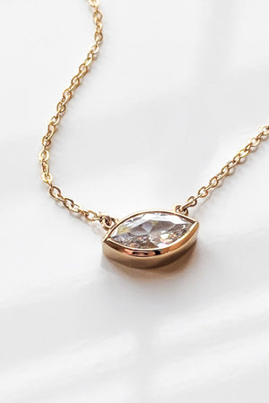 A Thatch IRIS necklace with a marquise CZ stone pendant.