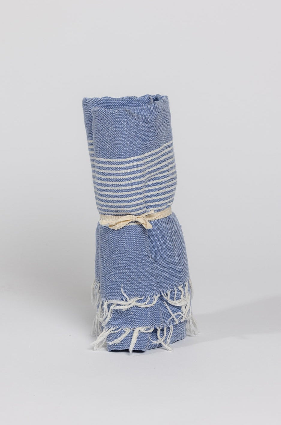 a blue Velvet by Graham & Spencer turkish towel on a white background.