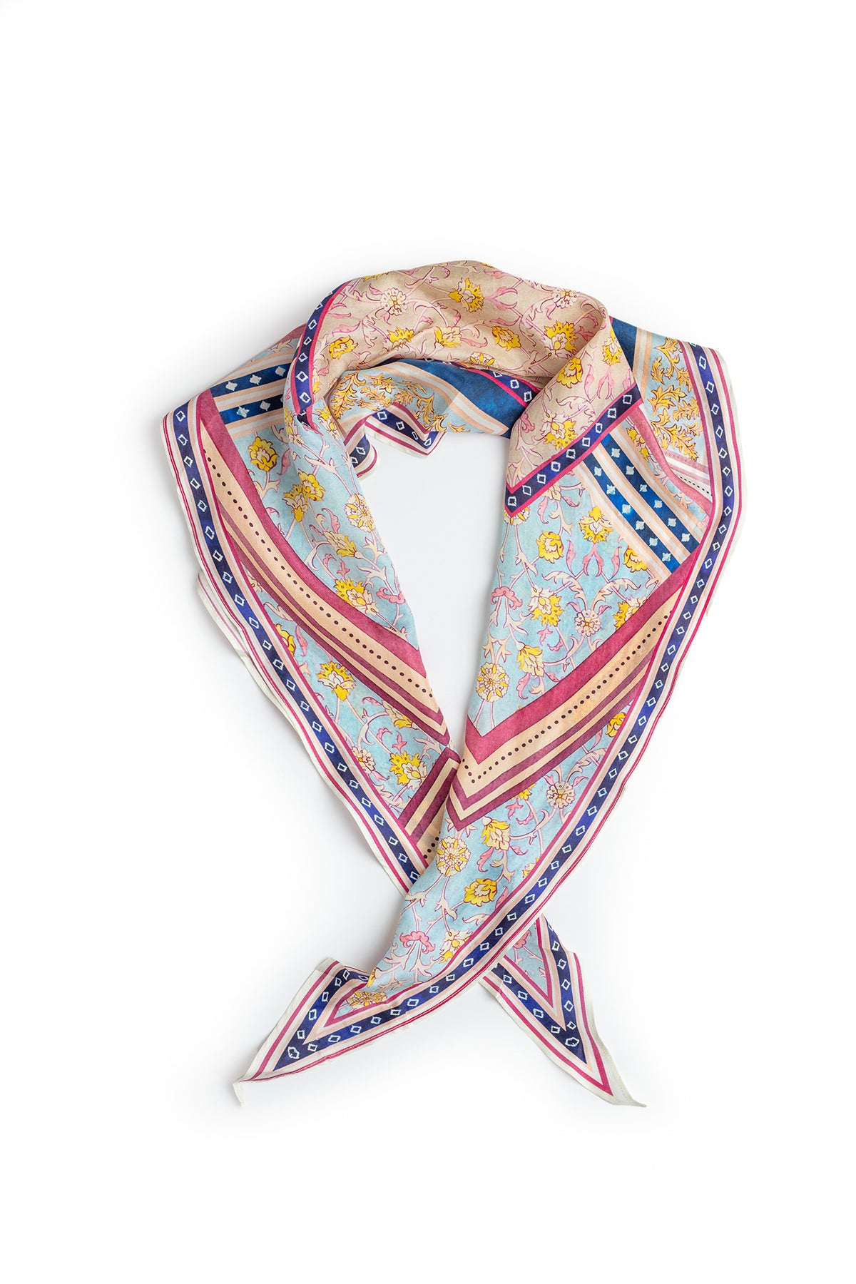 A square, multicolored silk scarf with floral and geometric patterns from Velvet by Graham & Spencer is laid flat. This elegant DIAMOND SHAPE SILK SCARF features a mix of pink, blue, and beige tones with intricate designs.-15057711628481