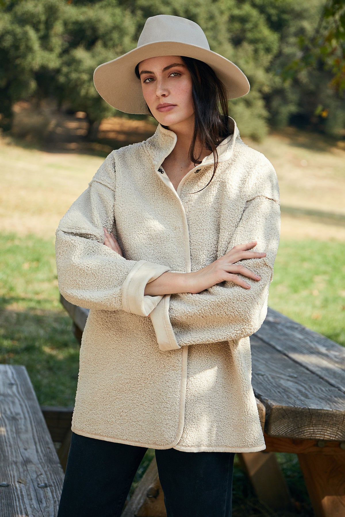 A woman wearing the Velvet by Graham & Spencer LUXE AVA FEDORA hat and a timeless taupe jacket.-8031454658641