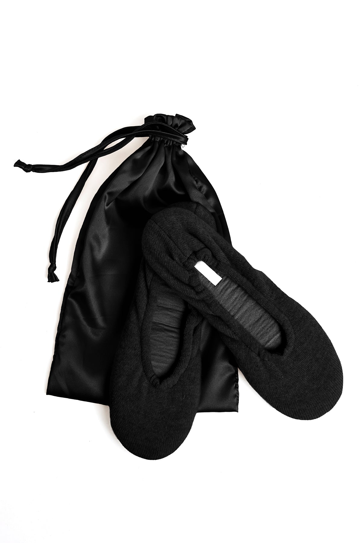 A timeless pair of black Cashmere Ballet Flat Slippers by Skin on a white background.-15274767483073