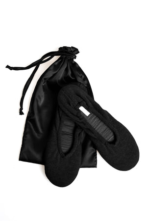 A timeless pair of black Cashmere Ballet Flat Slippers by Skin on a white background.