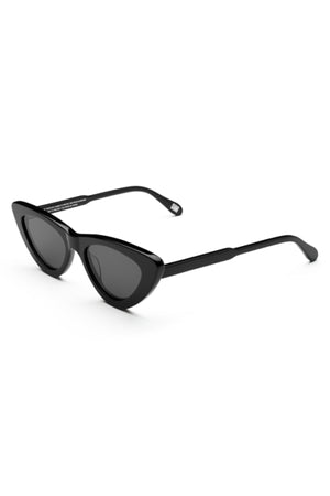A pair of 006 BY CHIMI EYEWEAR black cat-eye sunglasses with dark lenses from Chimi is displayed on a white background, highlighting these stylish unisex shades.