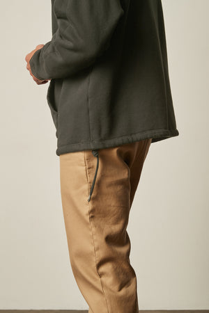 Baldwin Quarter-Zip Sweatshirt in dillweed side hem detail