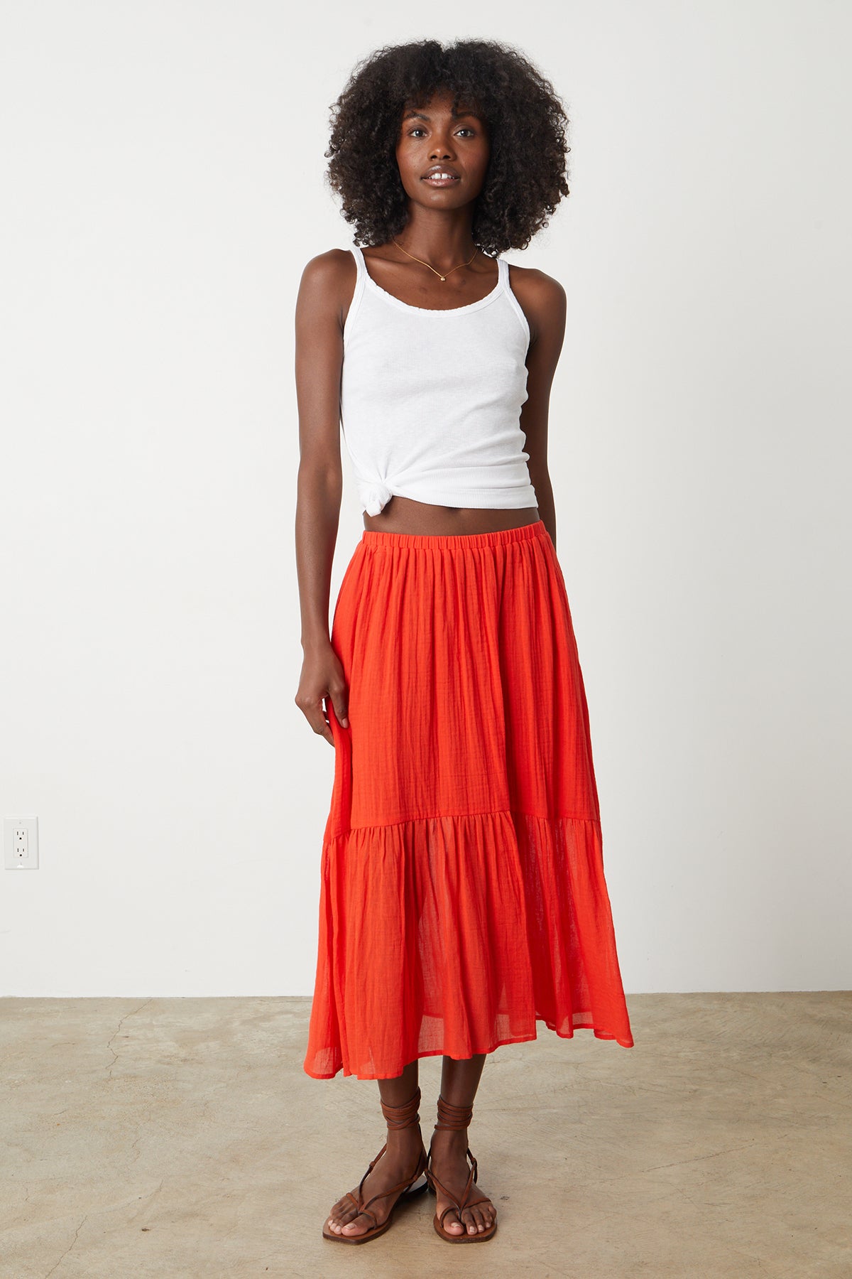 Mckenna Tiered Skirt in bright cardinal red with Aliza tank tied with knot to show waist full length front-26255713435841