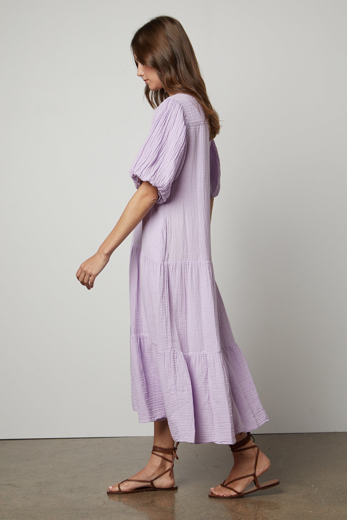 The back view of a woman wearing a Velvet by Graham & Spencer Pauline Cotton Gauze Midi Dress.-25947065516225