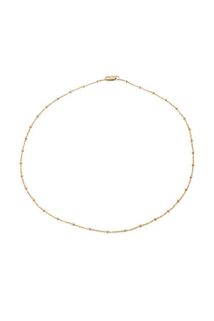 The DOT CHAIN CHOKER by Mara Carrizo Scalise is a delicate gold-filled beaded choker with small accents and a lobster clasp, shown on a white background.