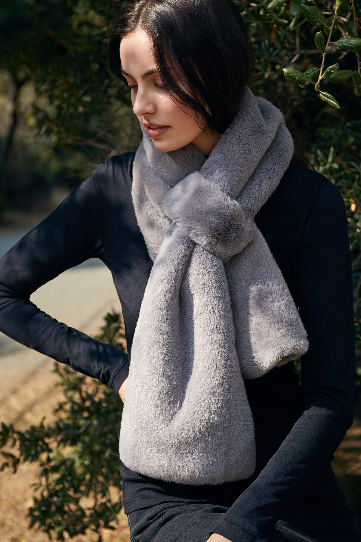 A woman wearing a Velvet by Graham & Spencer FAUX FUR PULL THRU SCARF.-8031460687953