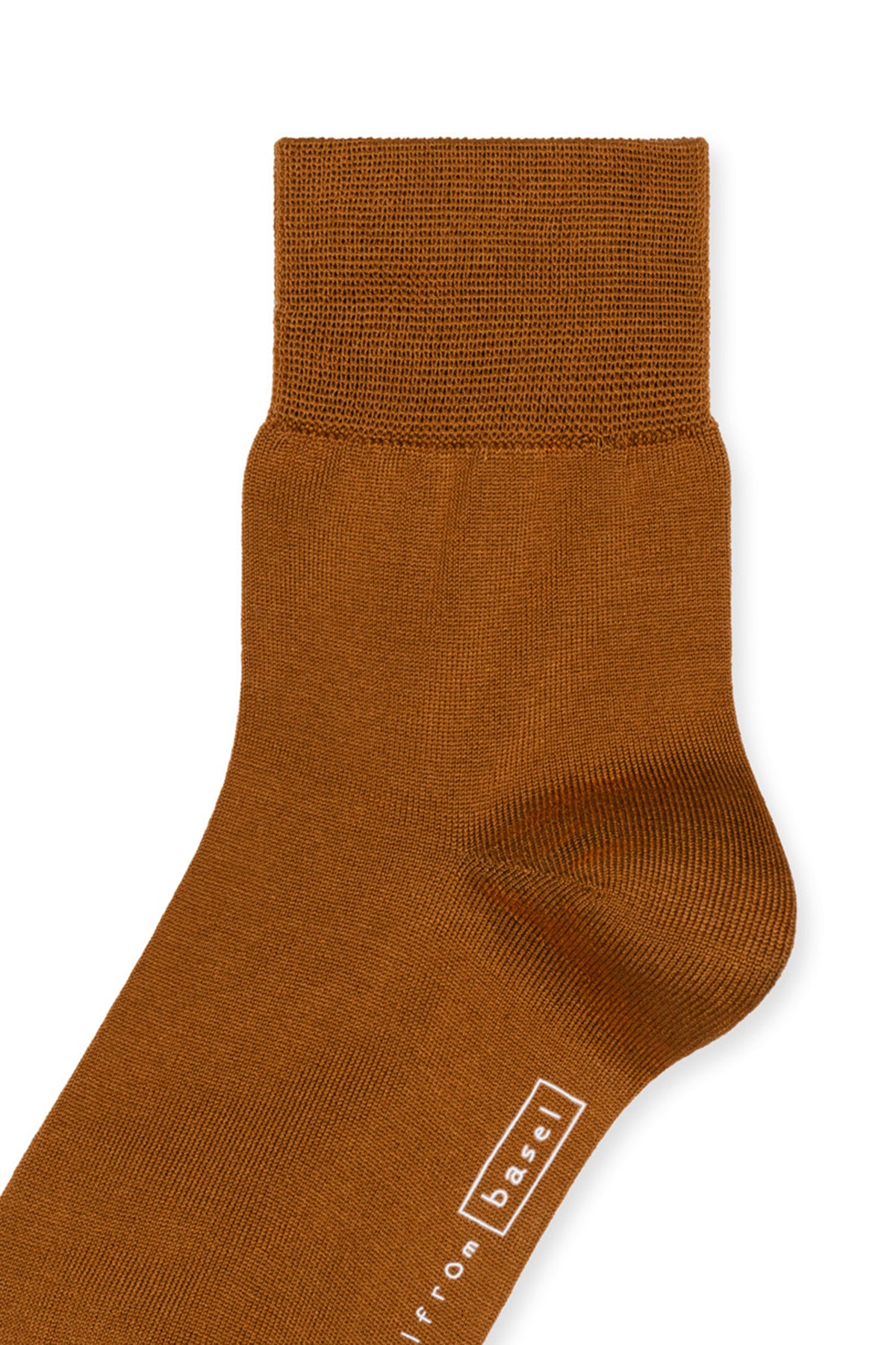 A side view of a brown sock with a textured top, crafted from luxurious mercerized cotton, featuring the brand name "Hansel From Basel" near the toe. This is the TROUSER CREW SOCKS BY HANSEL FROM BASEL.-145814224977