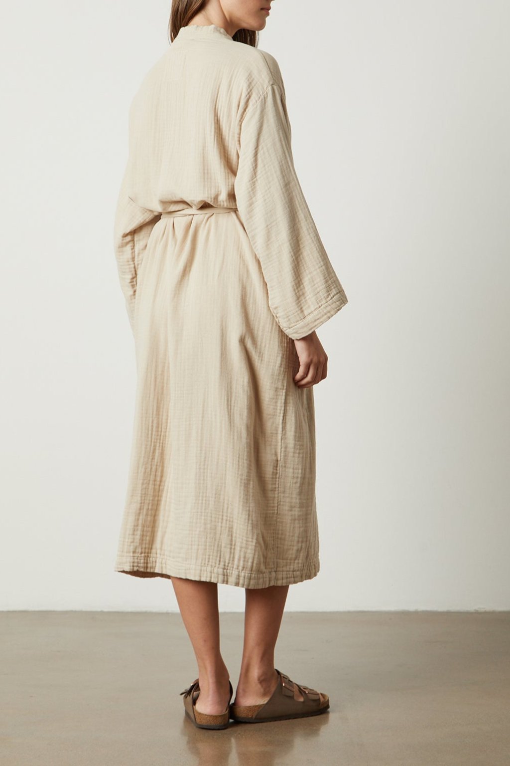 the back view of a woman wearing a Jenny Graham Home COTTON GAUZE ROBE.