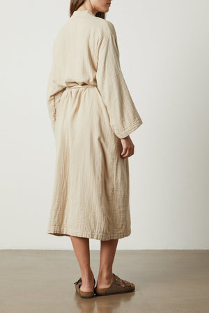 the back view of a woman wearing a Jenny Graham Home COTTON GAUZE ROBE.