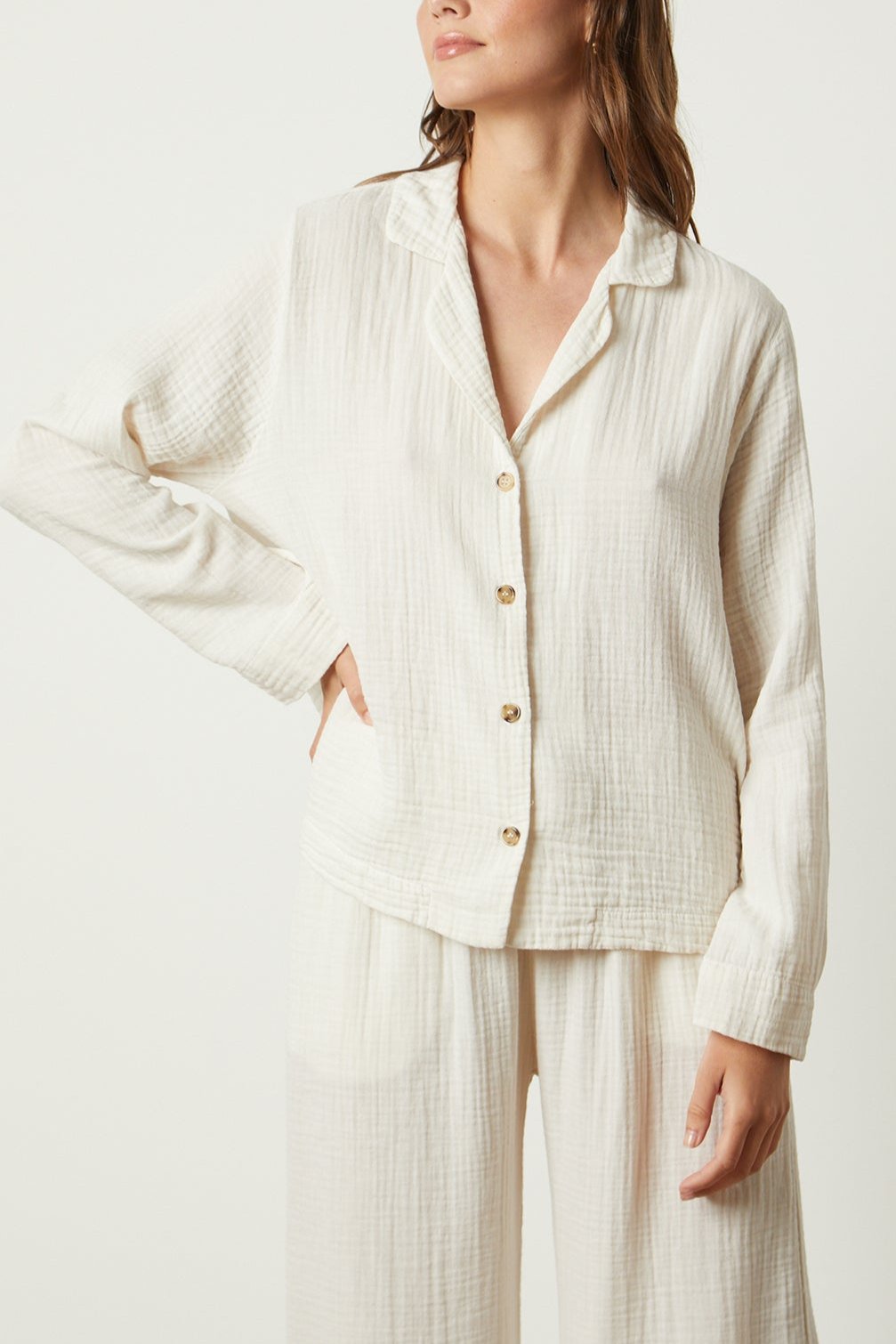 The model is wearing a white Jenny Graham Home pyjama shirt and pants.-25519547842753
