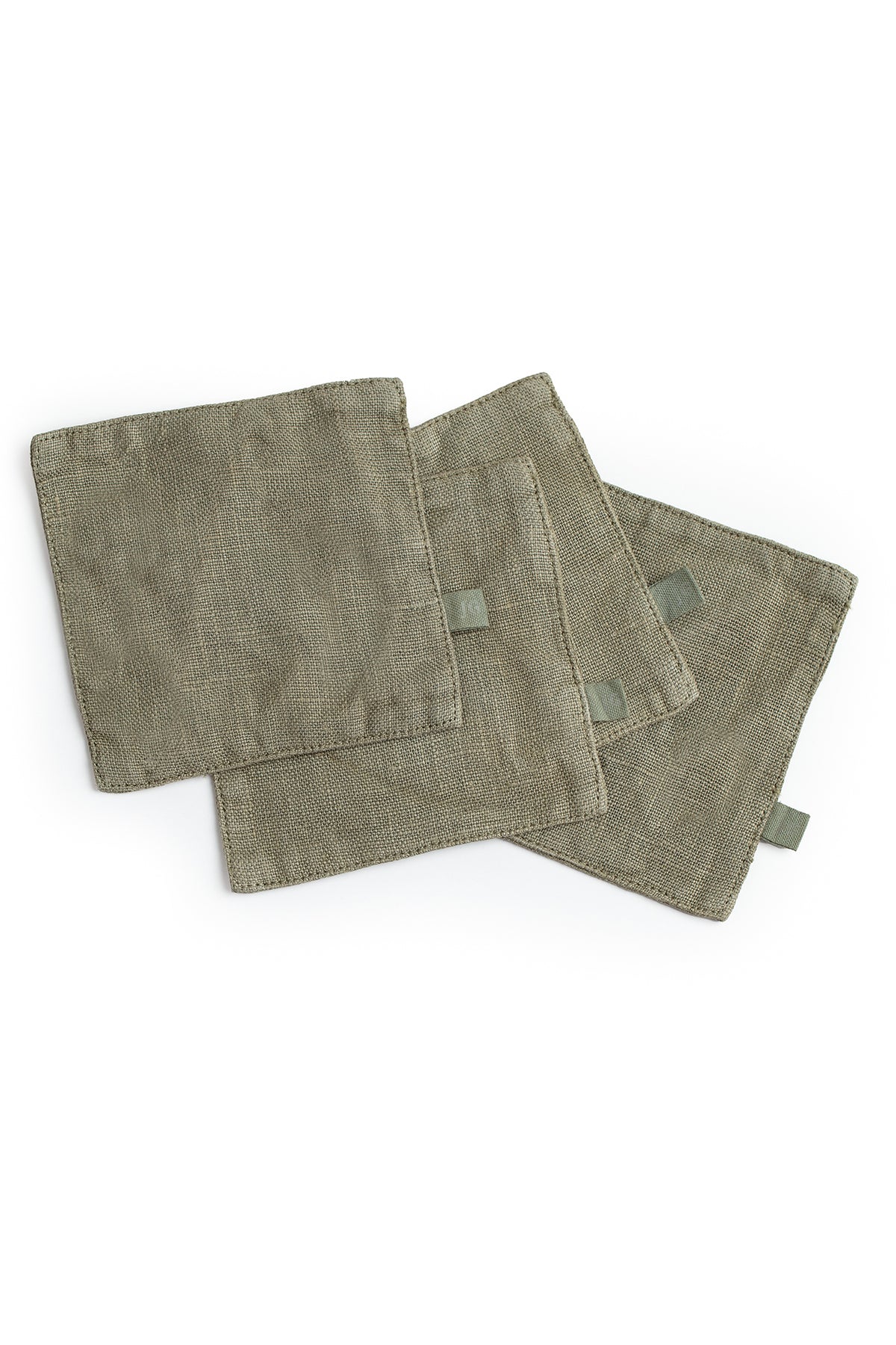 A set of four Jenny Graham Home linen coasters on a white surface.-15073230618817