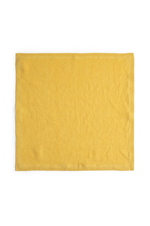 Yellow elegant LINEN NAPKIN isolated on a white background by Jenny Graham Home.