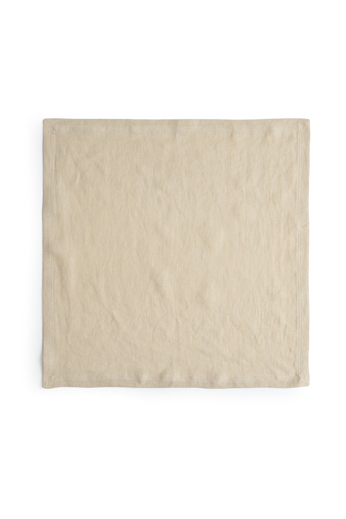 A beige linen napkin with a luxe finish on a white background from Jenny Graham Home.