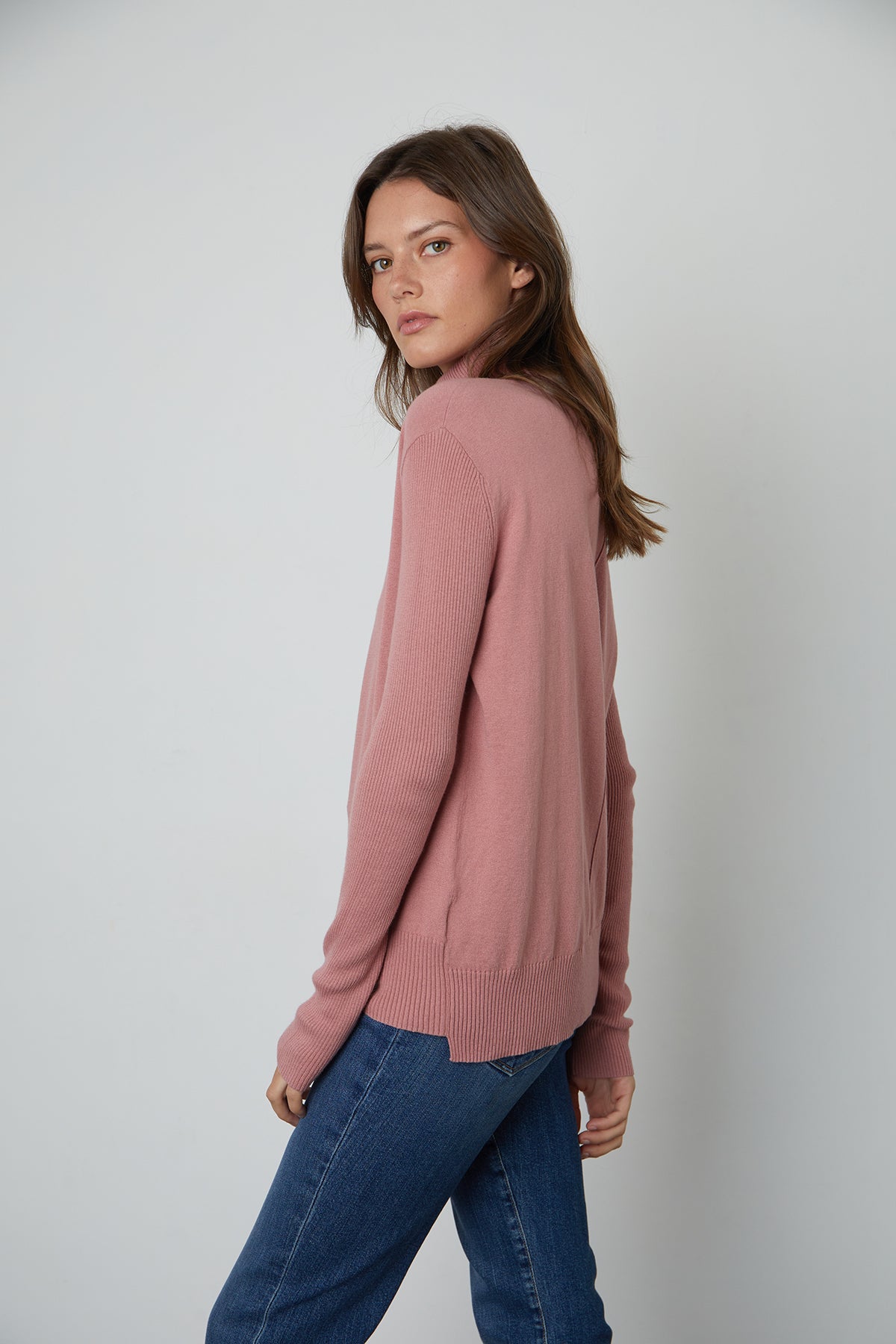 The model is wearing a Velvet by Graham & Spencer Renny turtleneck sweater, perfect for layering in the fall.-25583815000257