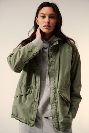 a woman wearing a Velvet by Jenny Graham MELROSE JACKET and a hoodie.