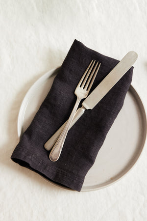 Jenny Graham Home linen napkin with fork and knife on a white plate, an everyday kitchen essential with a luxe finish.