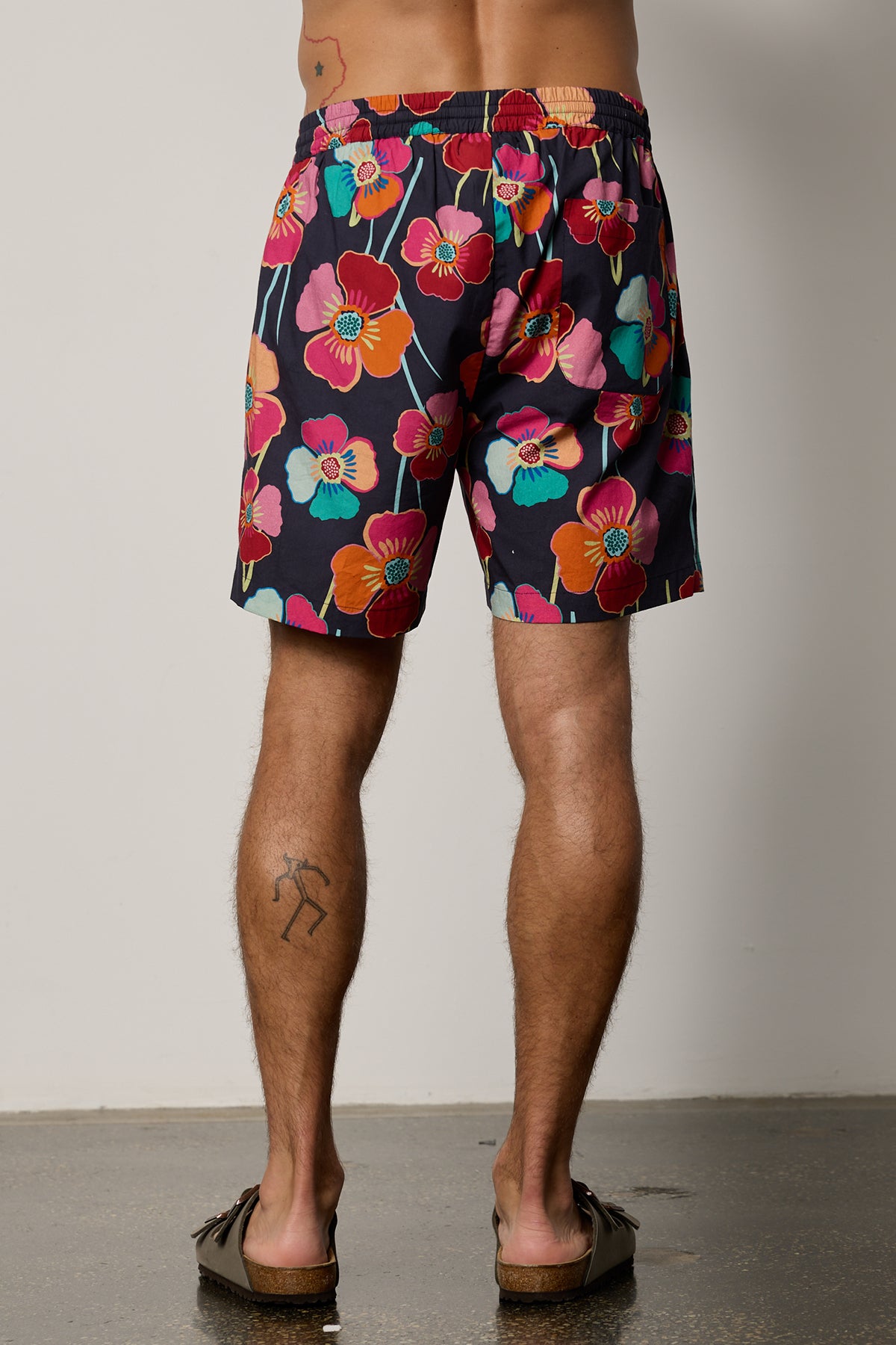 Colt Short back in bahama print with bold, multi colored floral pattern with dark background