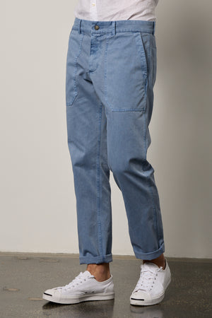 a man wearing blue Velvet by Graham & Spencer RALPH SANDED TWILL PANT and white sneakers.