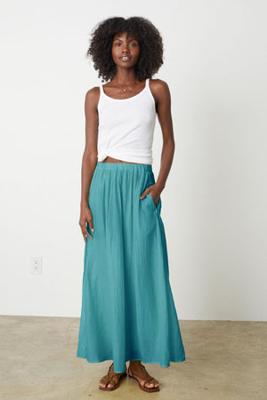 The model is wearing a Velvet by Graham & Spencer Mariela Maxi Skirt.