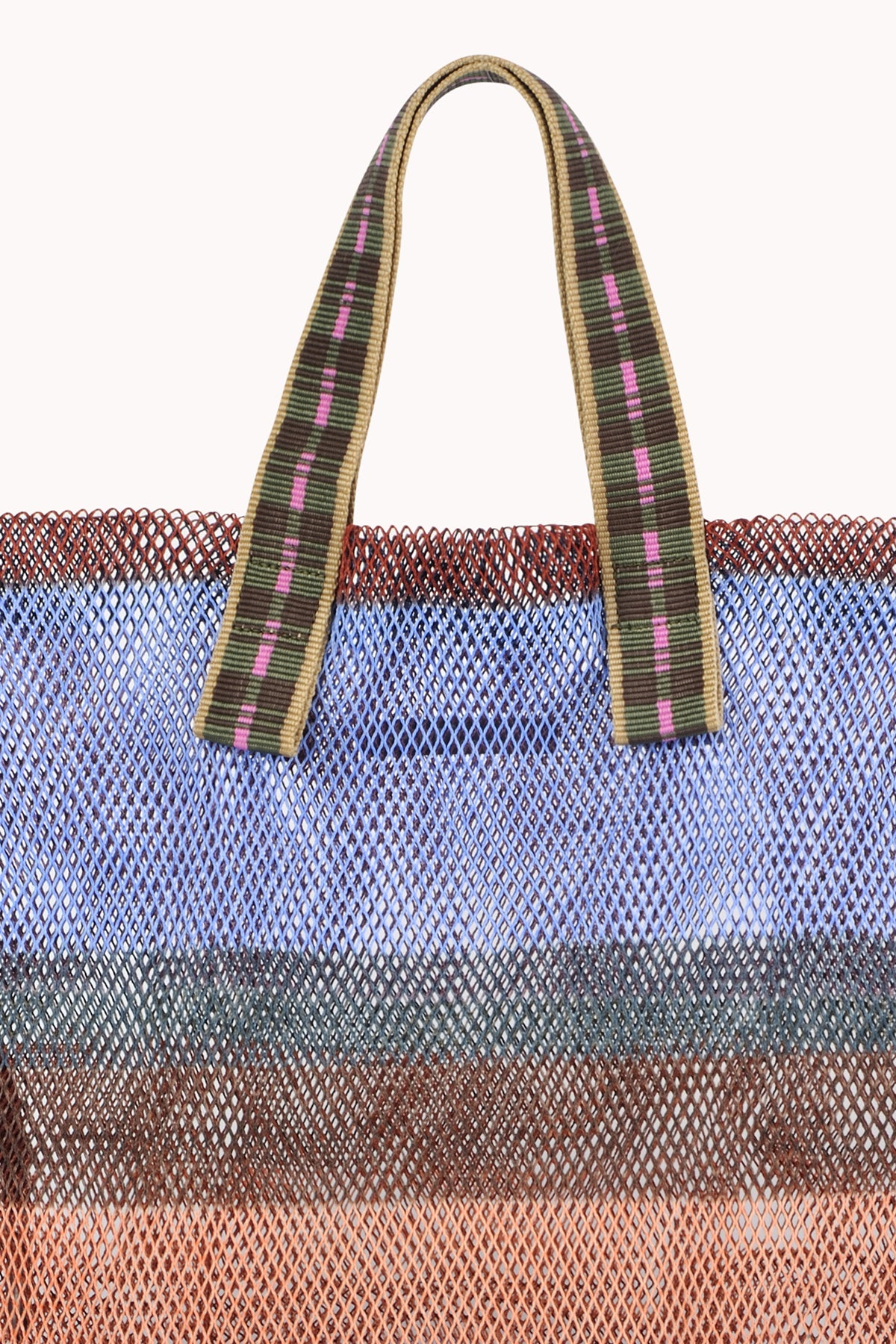 Close-up of the SMALL STRIPED MESH TOTE BY EPICE, featuring bold blue, brown, and orange bands with striped handles—Epice’s tote blends striking colors and natural fibers in a compact, stylish design.-24508107718849