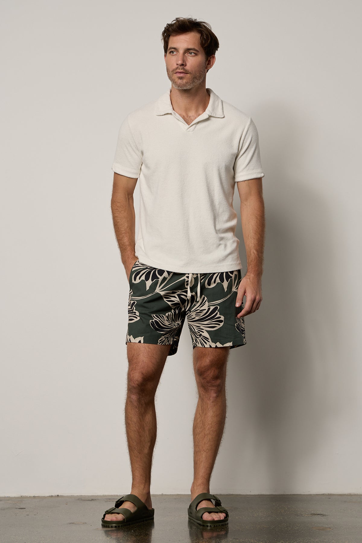Colt Short front in catalina print with bold, black and cream pattern on dark green background with Boris Polo in ecru, full length front with Birkenstocks-26266340688065