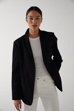 Velvet by Jenny Graham Oversized Echo Blazer in Vintage Black over Cruz Tank Top in White Tucked into White Denim Front 2