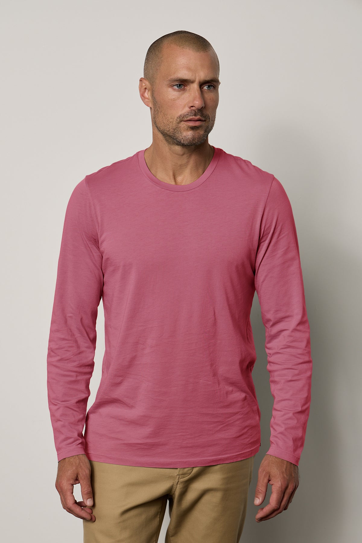 A man wearing a Velvet by Graham & Spencer SKEETER WHISPER CLASSIC CREW NECK TEE.