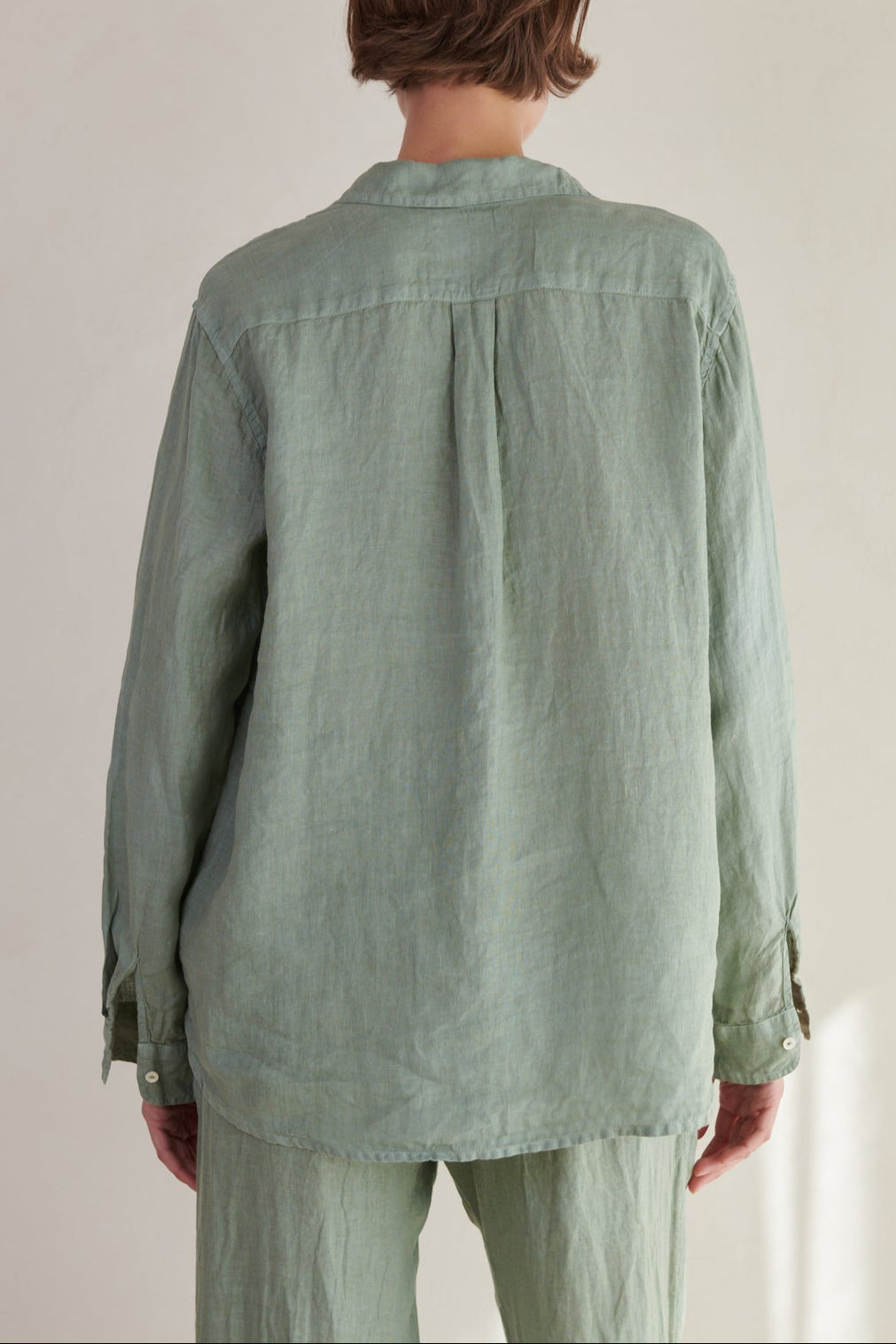 the back view of a woman wearing a Velvet by Jenny Graham Mulholland Shirt and pants.-26293074690241