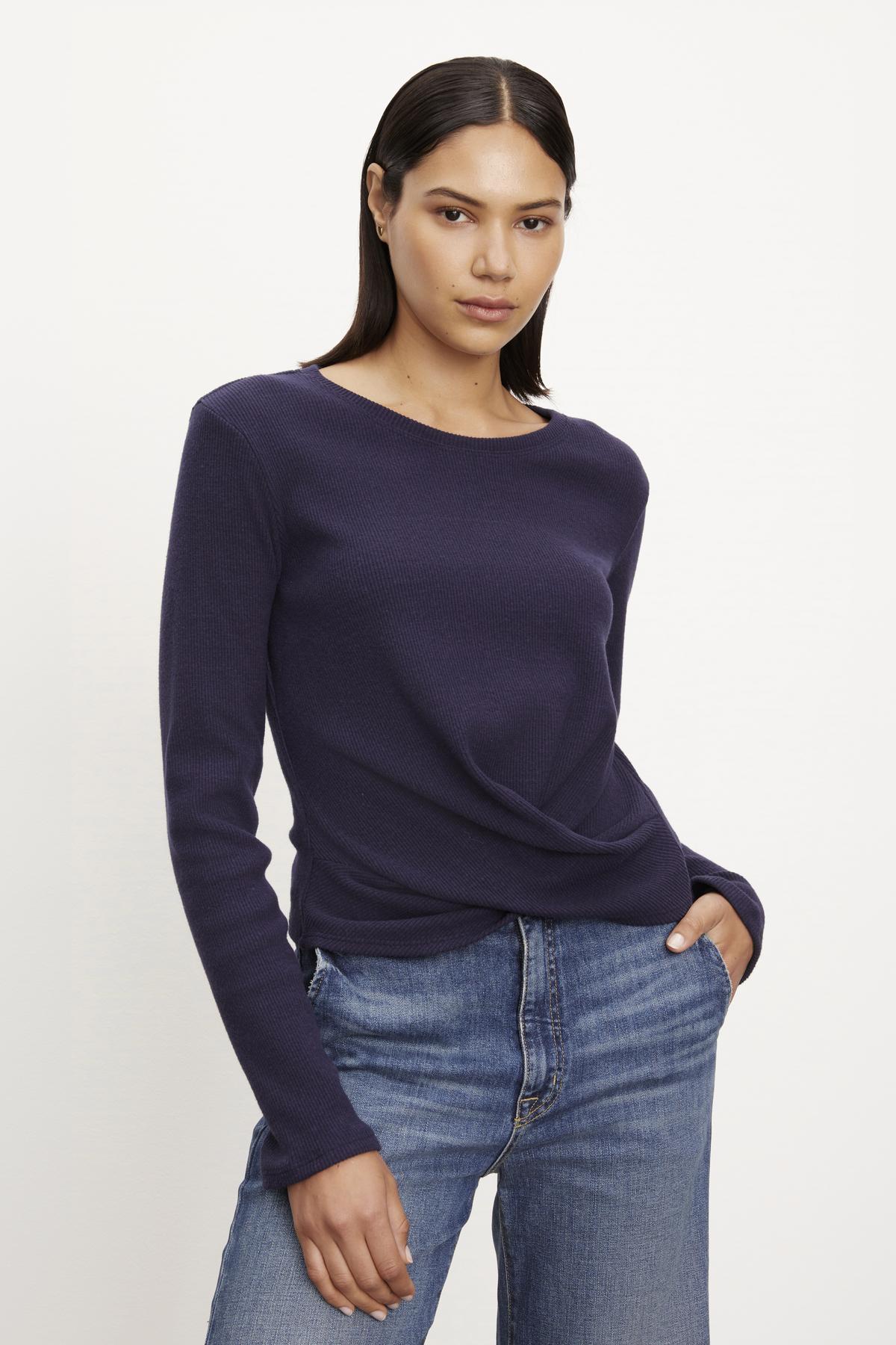 The model is wearing a GEONNA BRUSHED RIB TOP sweater and jeans.-36095789990081