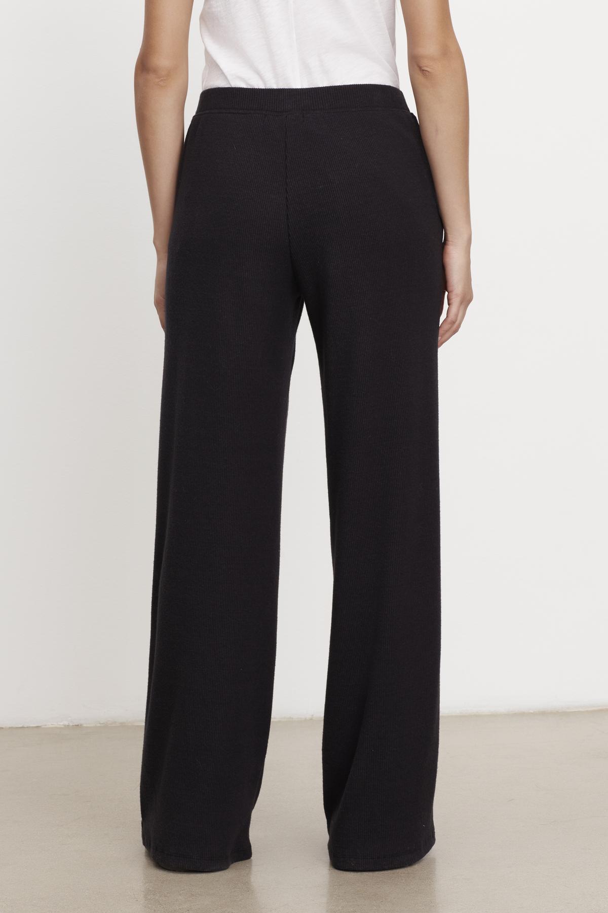   The back view of a person wearing Velvet by Graham & Spencer's KACIE BRUSHED RIB PANT. 