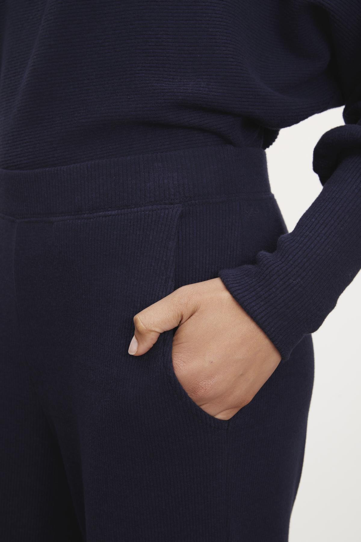   Navy ribbed joggers by Weekend Max Mara. 

New Sentence: KACIE BRUSHED RIB PANT by Velvet by Graham & Spencer. 